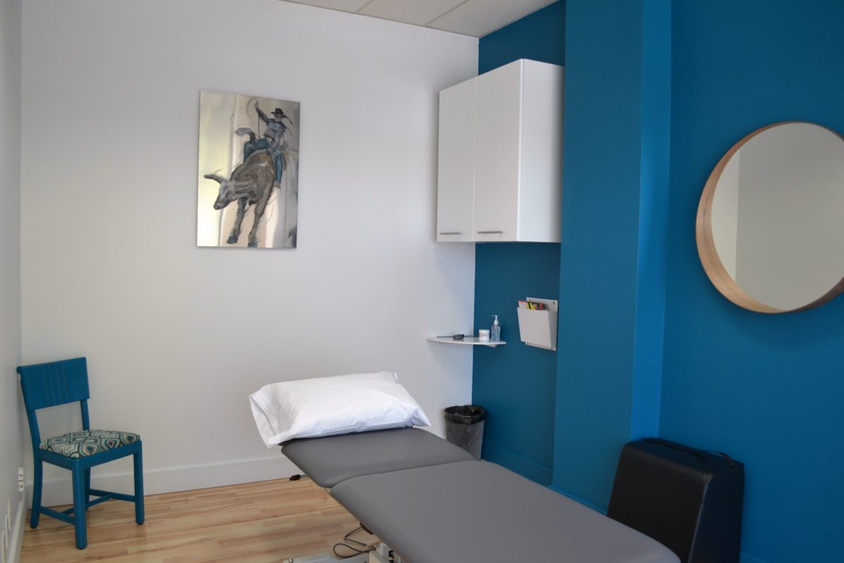 The image shows the setup of a private treatment room at Sports and Performance Physical Therapy.
