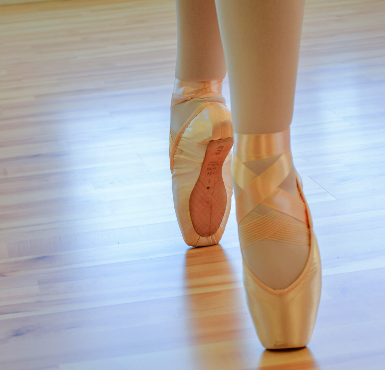 A photo of a ballet dancer's toes en pointe.